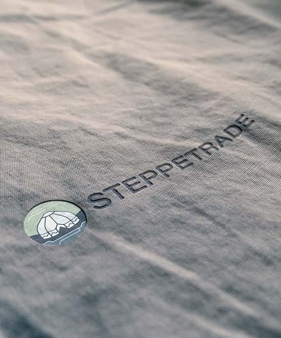 Steppetrade logo on folded fabric, mockup