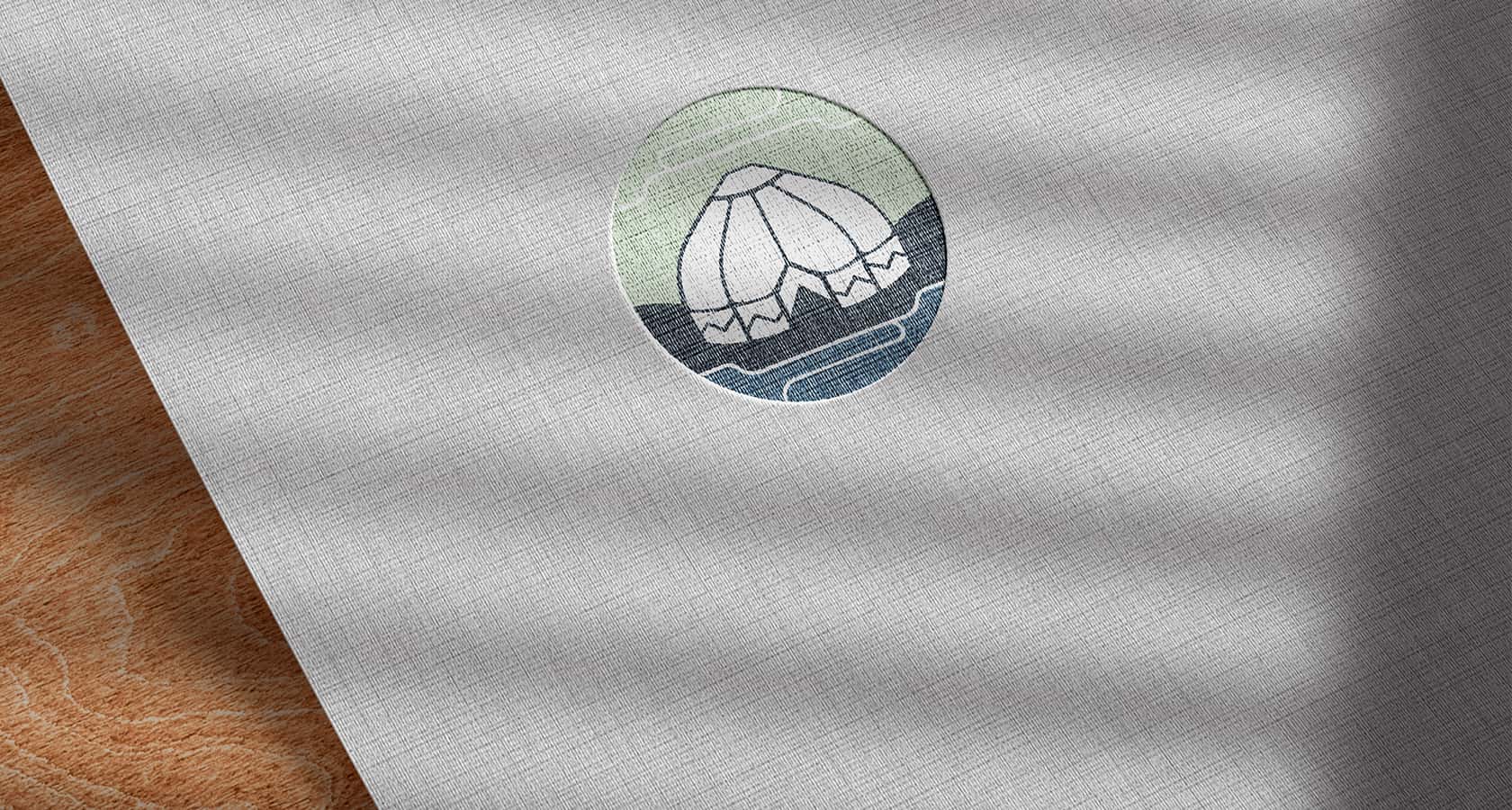 Steppetrade logo on a gray fabric background, mockup